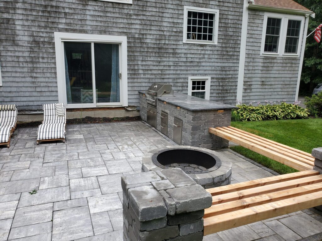Built-in wood seating connecting the Duxbury masonry pillars