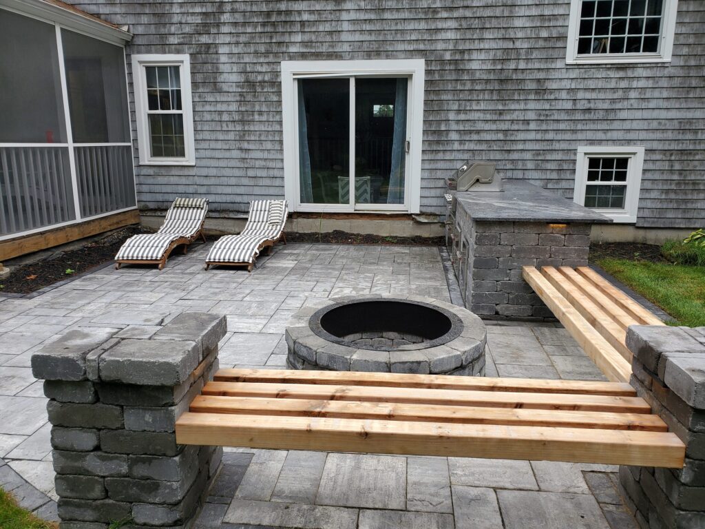 Central fire-pit area framed by masonry pillars and built-in seating
