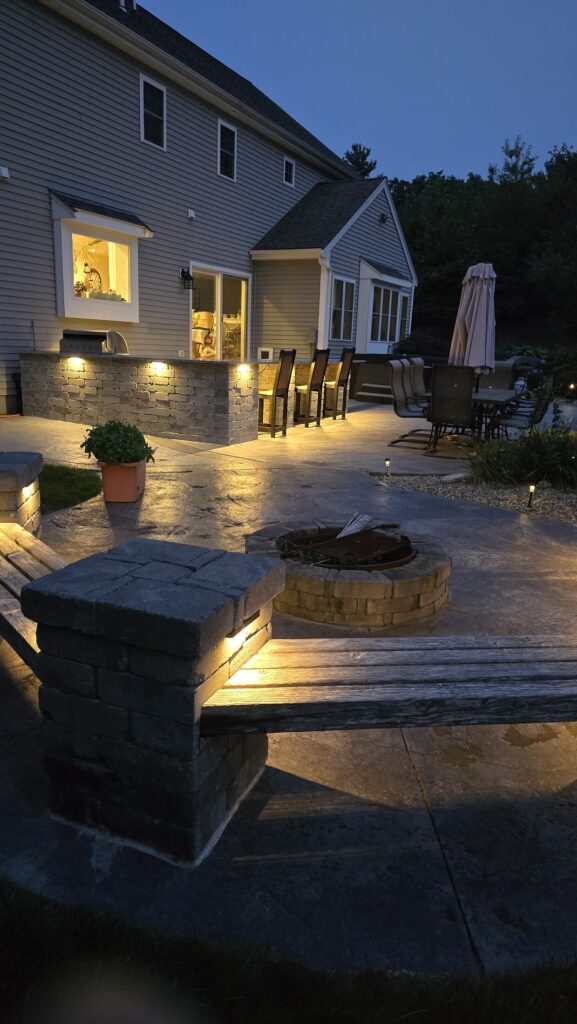Vertical view of the illuminated Halifax fire-pit patio and kitchen