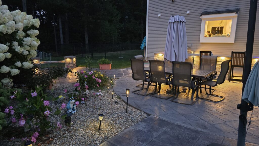 Dining terrace and planted edge at the Halifax project after dark