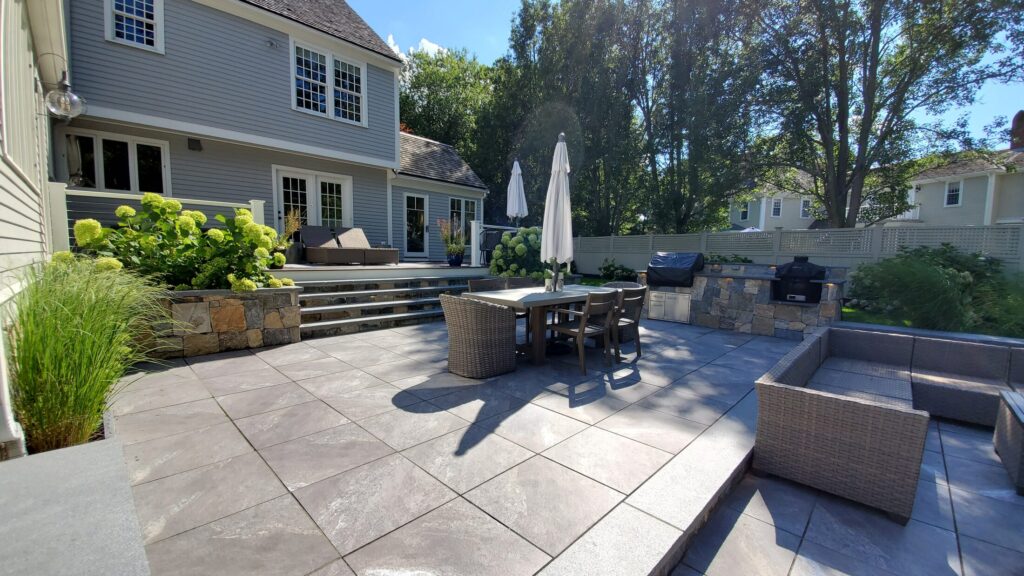 Wide view across the Hingham patio, dining and cooking zones