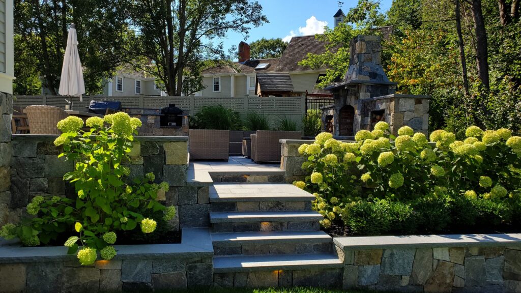 Broad stone steps leading to the upper Hingham gathering terrace