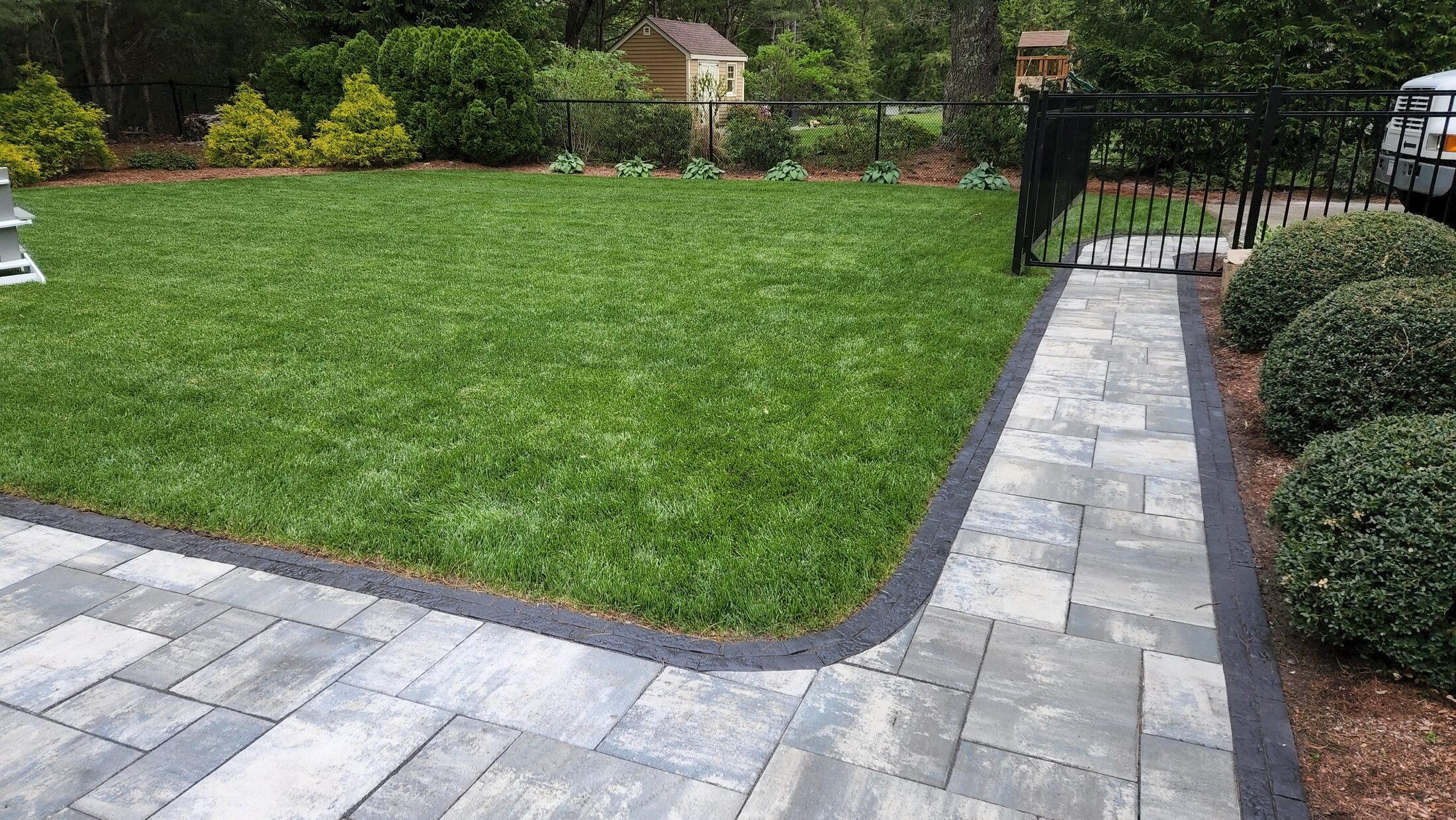 Pool patio and lawn transition in Mansfield Massachusetts
