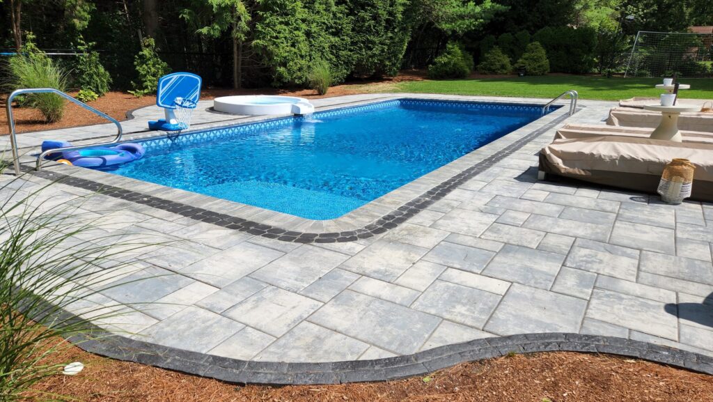 Wide finished view of the Mansfield pool patio and curved border