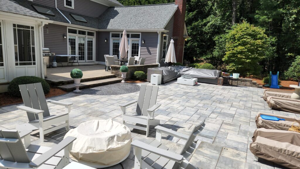 Patio seating area connecting the Mansfield pool to the home