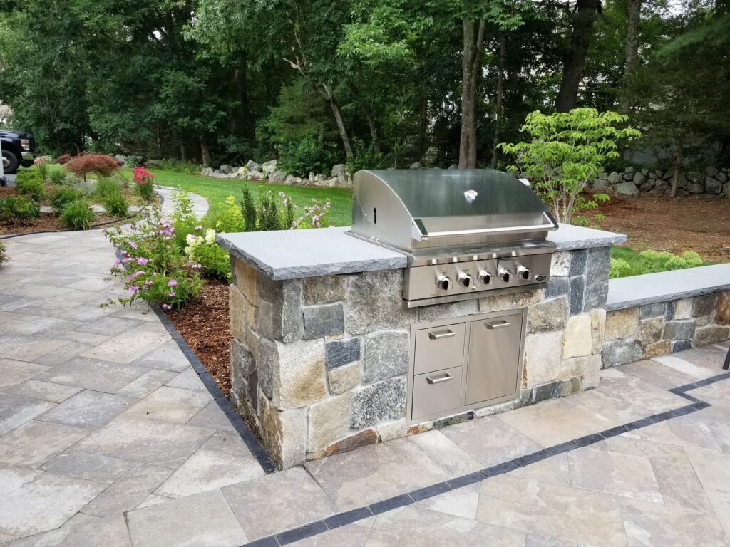 Masonry outdoor kitchen integrated into the Easton patio