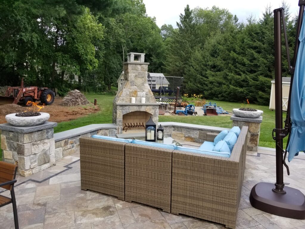 Masonry fireplace and seating terrace in Easton