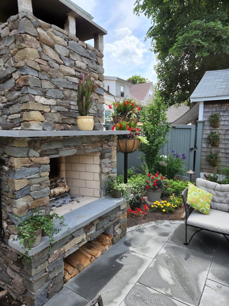 Close view of the natural-stone outdoor fireplace in Quincy